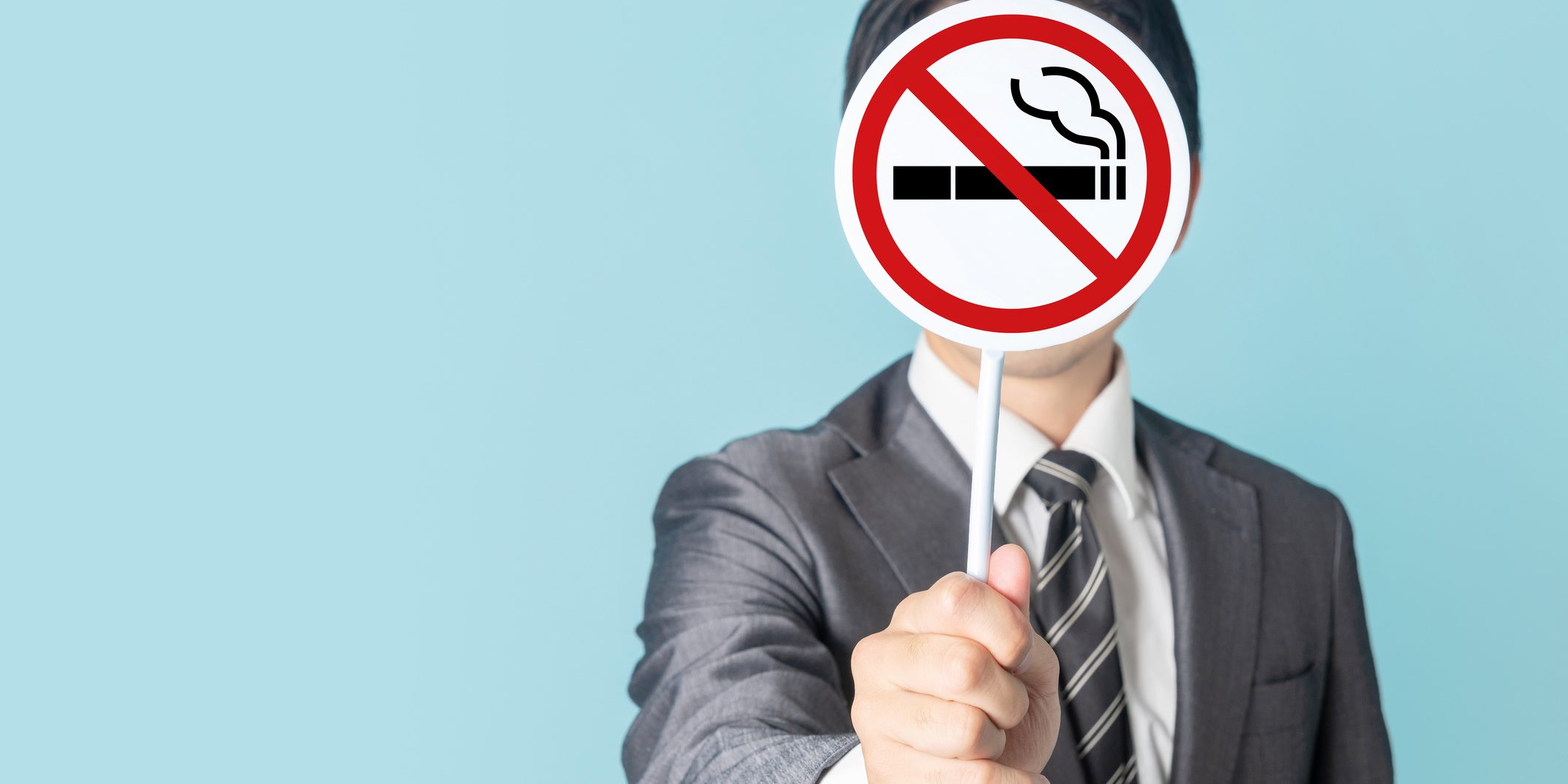 Man showing a No Smoking mark.