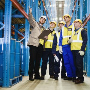 Workers talking in warehouse