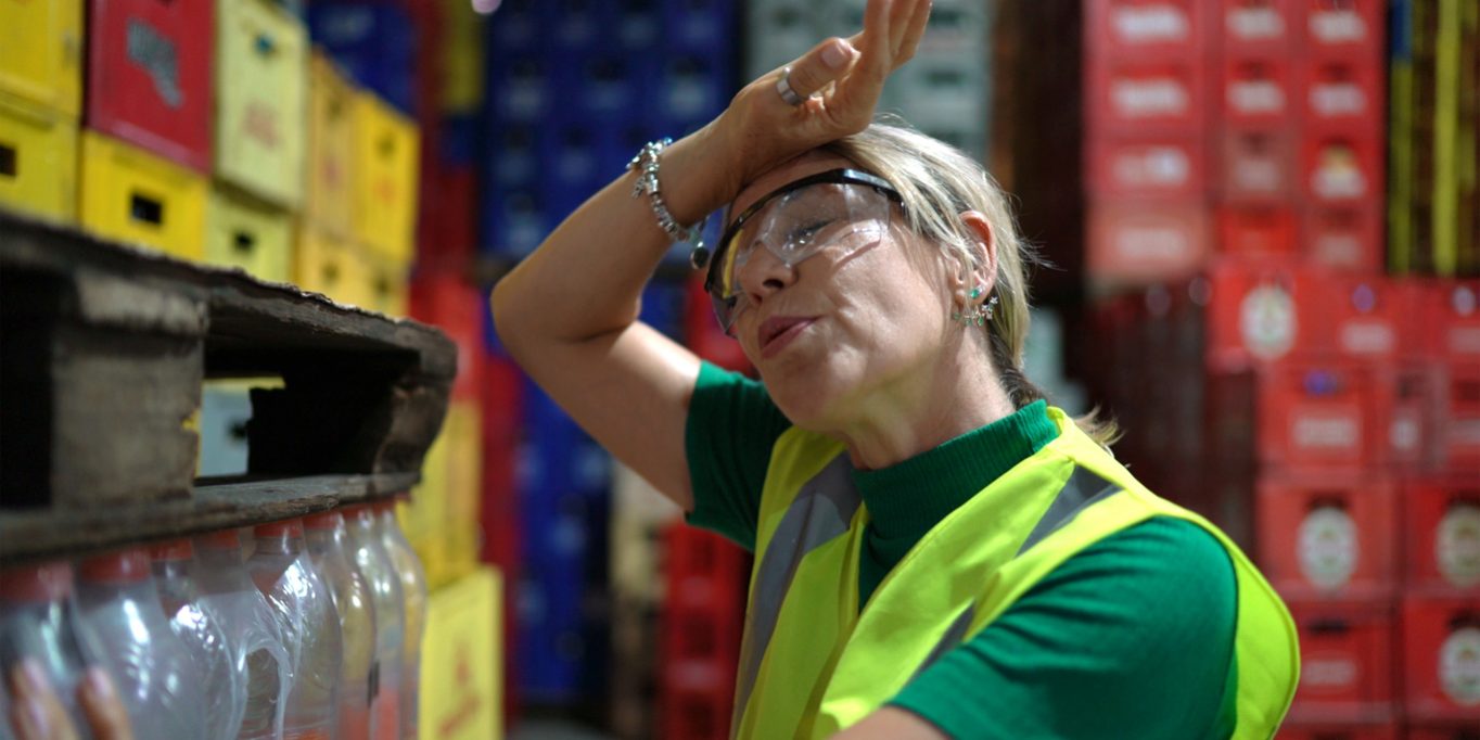 Exhausted employee at warehouse Exhausted employee at warehouse